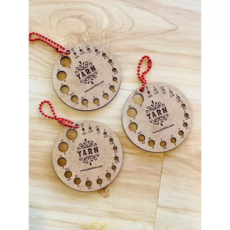 Small round wooden needle gauge